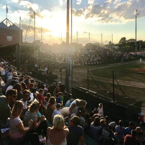 Fans in the grandstand at Cardines Field at sunset